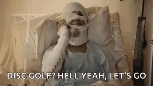 Man With Bandage on Head Laying in Hospital Bed