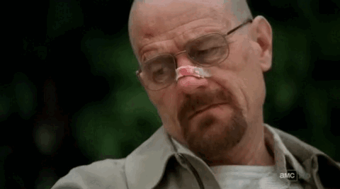 Man With Bandage On Nose And Glasses Looking Down GIF