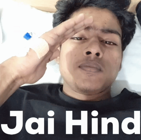 Man With Bandaged Finger Lying On Bed Saying Jai Hind GIF
