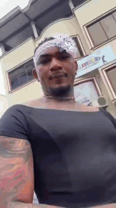 Man With Bandana In Black Shirt And Choker GIF