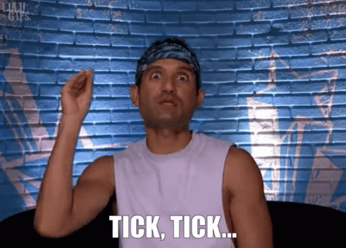 Man With Bandana Saying Tick Tick at Brick Wall