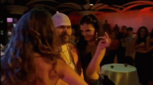 Man With Bandana Standing Next to Woman