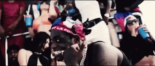 Man with Bandana Surrounded by Women