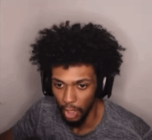 Man With Beard and Afro Wearing Headphones