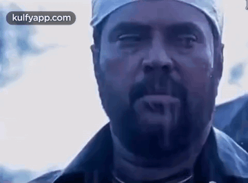 Man With Beard and Bandana Looking at Camera Mouth Open