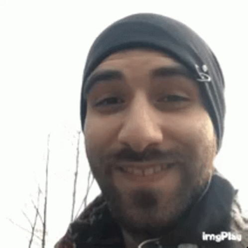 Man with Beard and Beanie Smiling