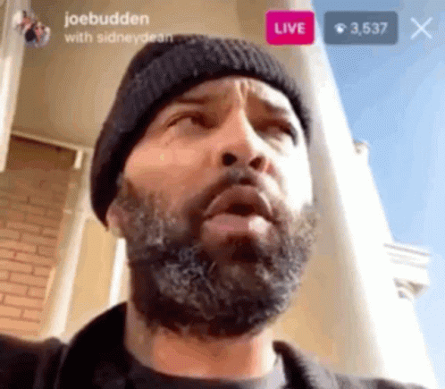 Man with Beard and Black Beanie Looking Up