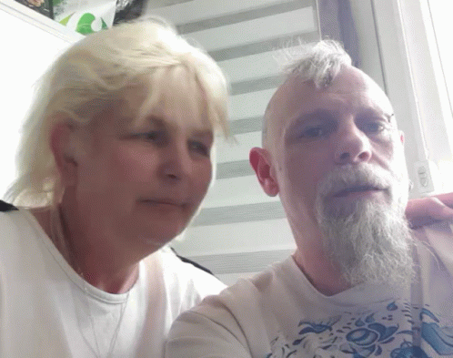 Man with Beard and Blonde Woman Posing