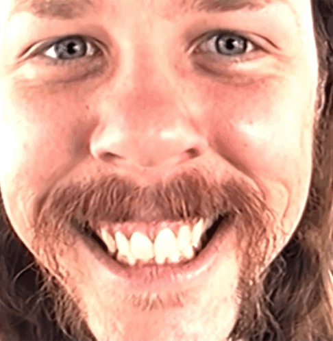Man With Beard and Blue Eyes Smiling