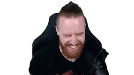 Man with Beard and Bun Making Face