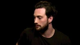 Man With Beard and Earrings Wearing Black Shirt