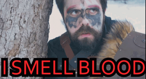 Man With Beard And Face Paint Next To Tree Saying I Smell Blood GIF