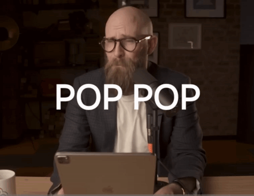 Man with Beard and Glasses at Desk