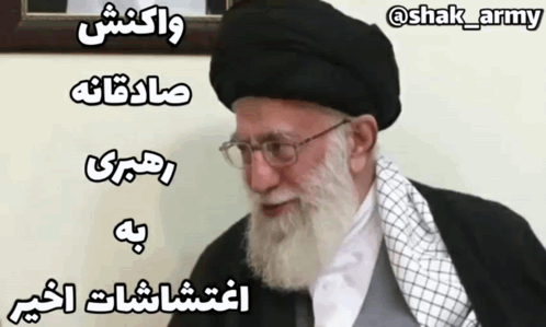 Man With Beard and Glasses in Black Hat and White Scarf