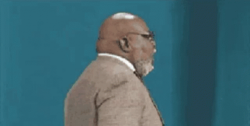 Man With Beard and Glasses in Suit and Tie