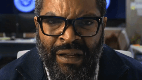 Man with Beard and Glasses Looking at Camera