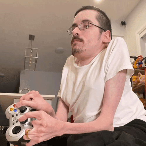 Man With Beard And Glasses Playing Video Game GIF