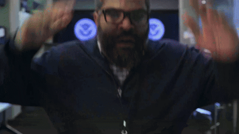 Man with Beard and Glasses Waving
