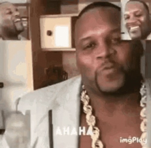 Man with Beard and Gold Chain Making Funny Face