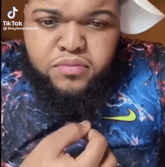 Man With Beard and Hat in Nike Shirt