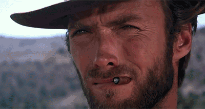 Man With Beard and Hat Smoking Cigarette