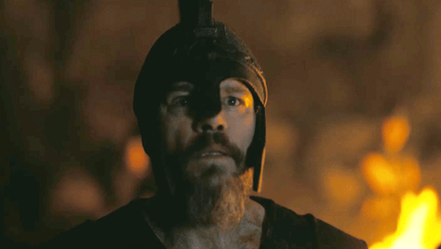 Man With Beard And Helmet Before Burning Fire GIF