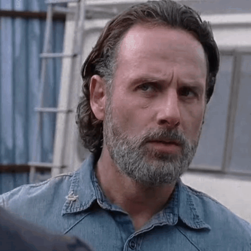 Man with Beard and Long Hair in Blue Denim Shirt