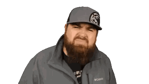 Man with Beard and Mountain Hat Making Funny Face