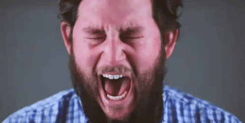 Man With Beard and Mustache Screaming