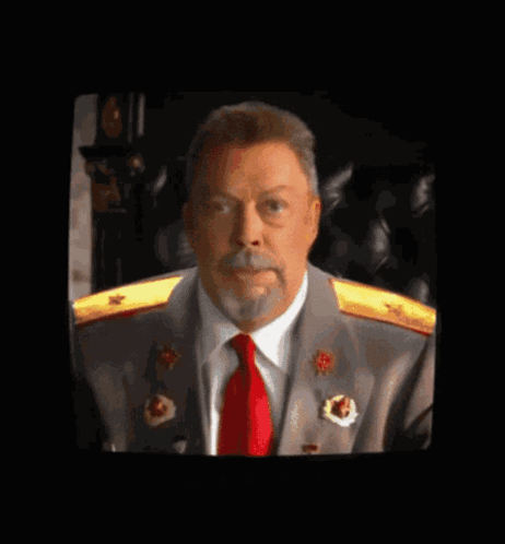 Man With Beard and Red Tie