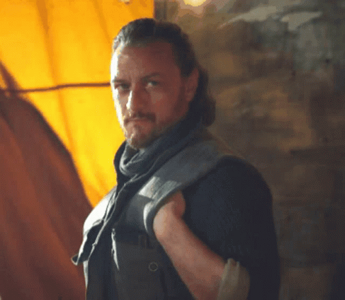 Man With Beard And Scarf Looking At Camera GIF