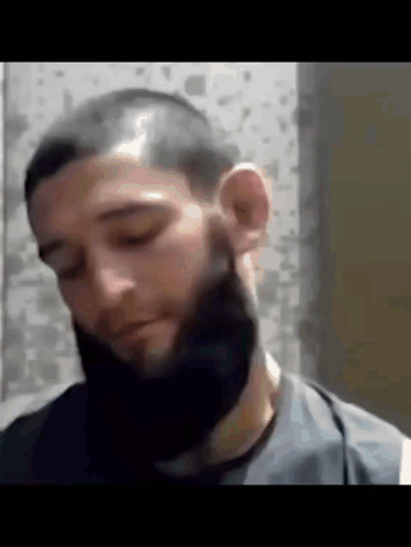Man with Beard and Shaved Head Looking Down