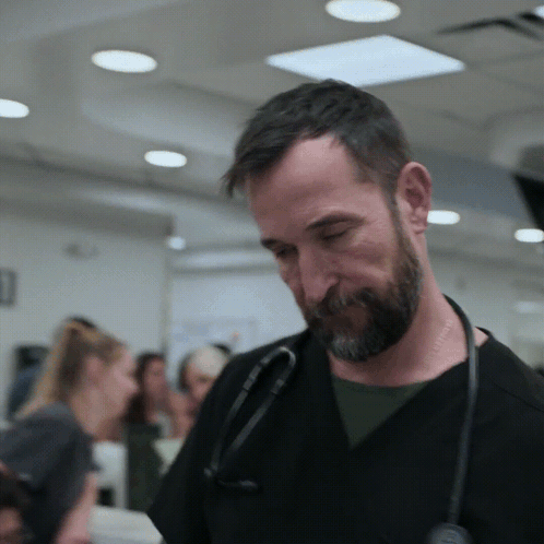 Man With Beard And Stethoscope Looking Down GIF