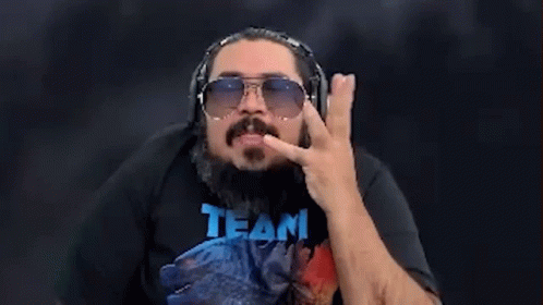 Man with Beard and Sunglasses Wearing Team Shirt