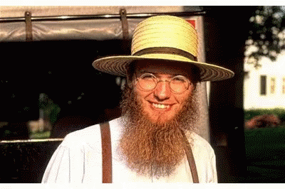 Man with Beard and Suspenders Smiling
