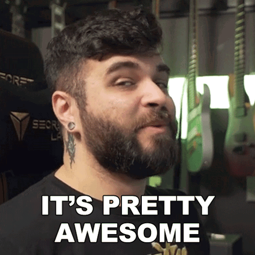 Man With Beard and Tattoo on Ear Says It's Pretty Awesome