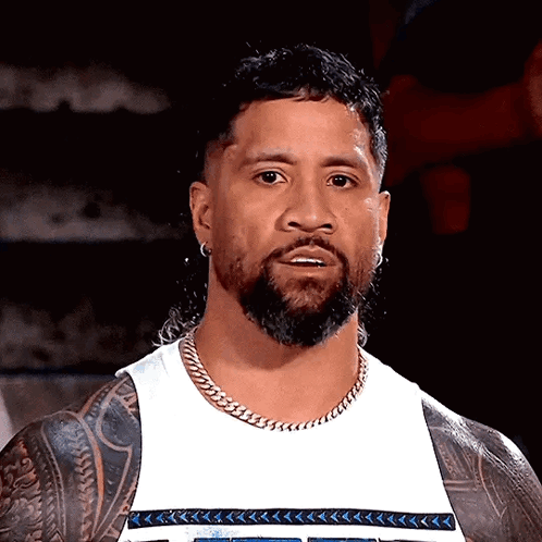 Man With Beard and Tattoos in White Tank Top