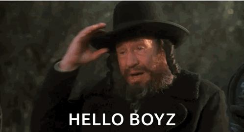 Man With Beard And Top Hat Saying Hello Boyz GIF