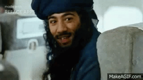 Man With Beard and Turban Smiling on Plane