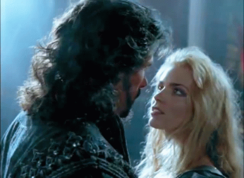 Man With Beard and Woman Blonde Hair Looking at Each Other