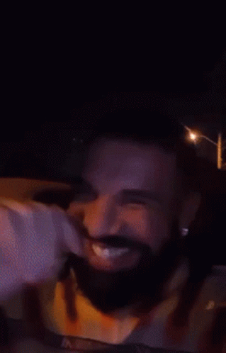 Man with Beard and Yellow Shirt Smiling
