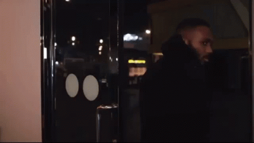 Man with Beard at Glass Door