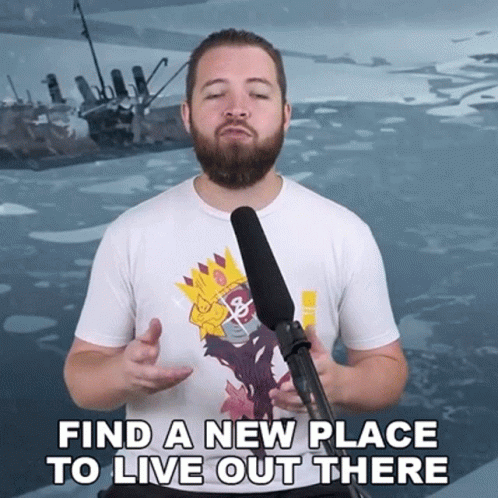 Man With Beard at Microphone Saying Find a New Place to Live Out There