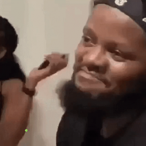 Man With Beard Brushed by Woman