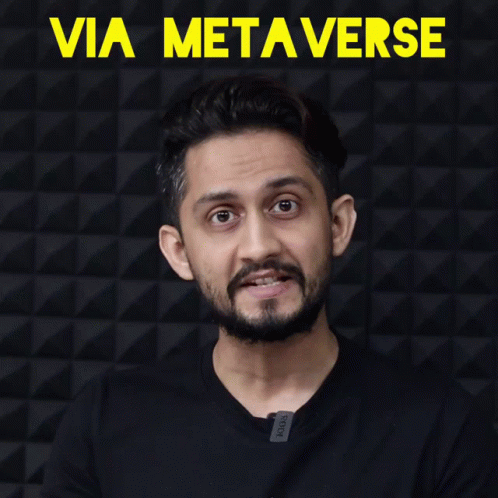 Man With Beard Clapping In Front Of Via Metaverse Wall GIF