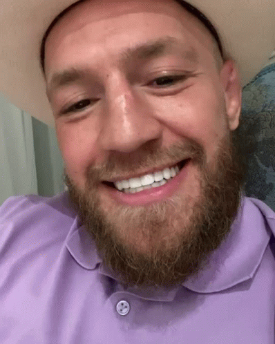 Man with Beard Cowboy Hat and Purple Shirt