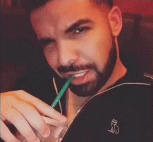 Man With Beard Drinking From Straw
