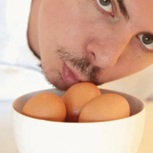 Man with Beard Eating Eggs