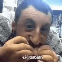 Man With Beard Eating Hamburger