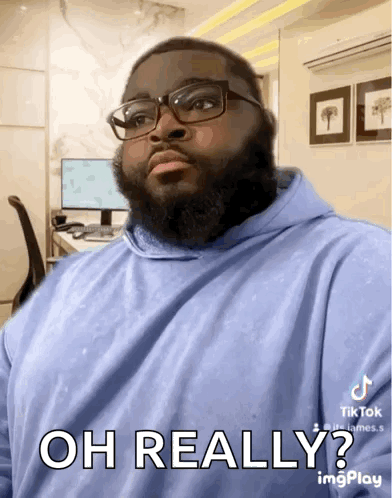 Man With Beard Glasses And Blue Hoodie Says Oh Really GIF